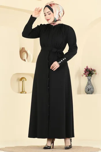 فستان محبوك باللون الأسود مع تفاصيل متموجة