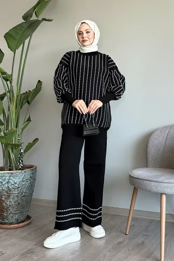 Full black knitted outfit with vertical trim and pants